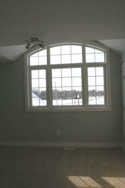 Large panel windows overlooking an empty room