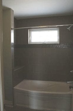 Bathtub and shower combo in a bathroom