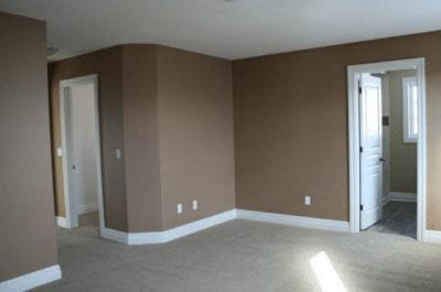 An empty room with doors leading to other rooms