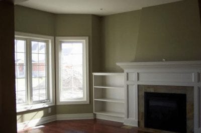 Empty great room with a large fireplace