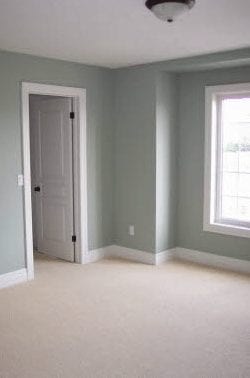 An empty room with carpeting