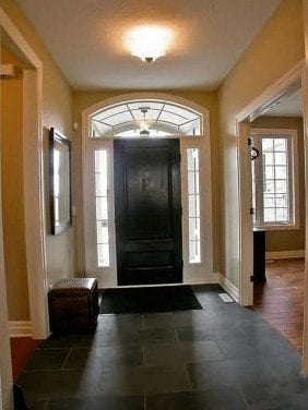 Hallway entrance leading into common area and kitchen