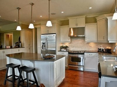 Large kitchen with breakfast bar overlooking dining area