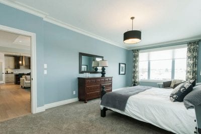Master bedroom with dresser and bed